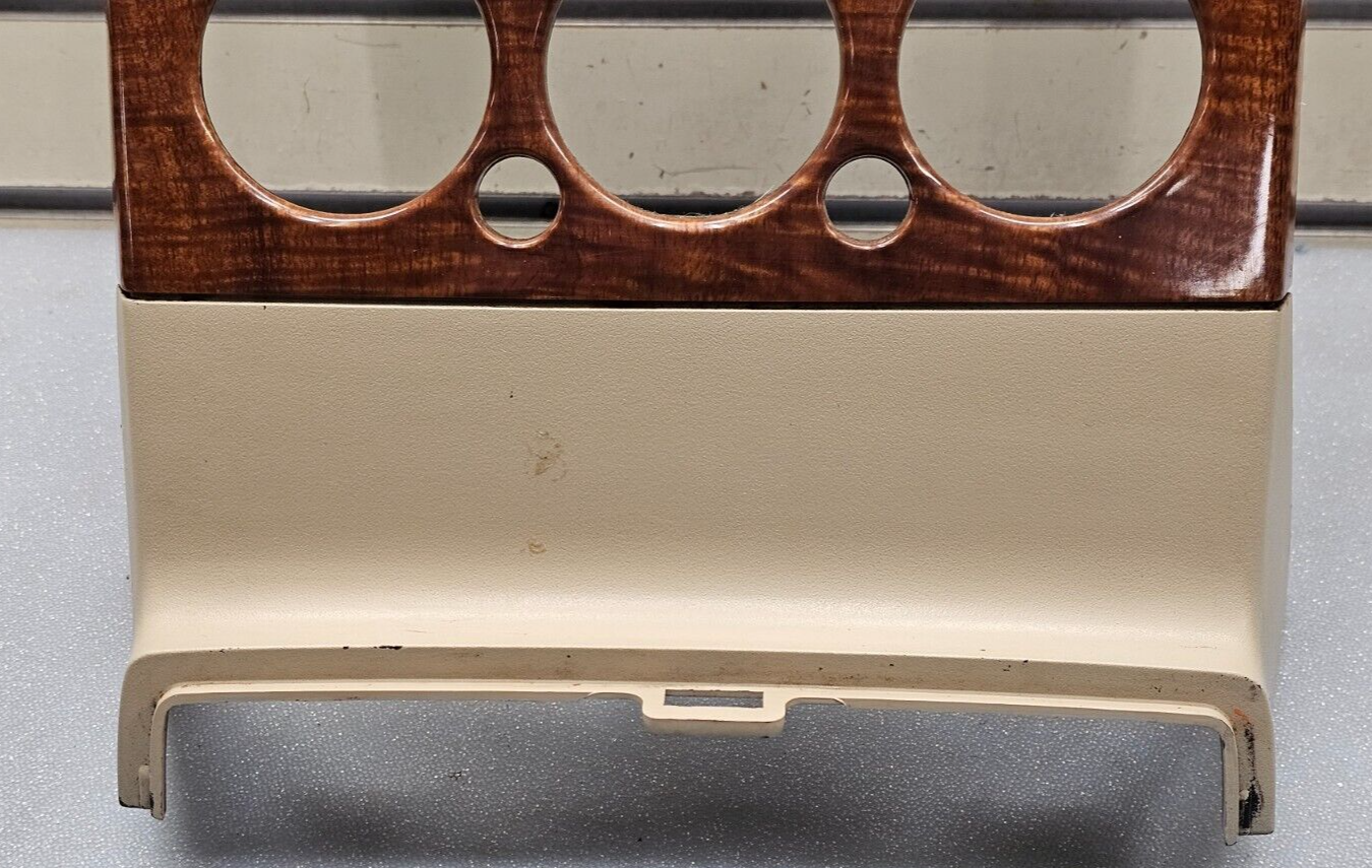 06-10 EXPLORER DASH AM FM RADIO STEREO DISPLAY CLIMATE PANEL BEZEL WOOD/TAN